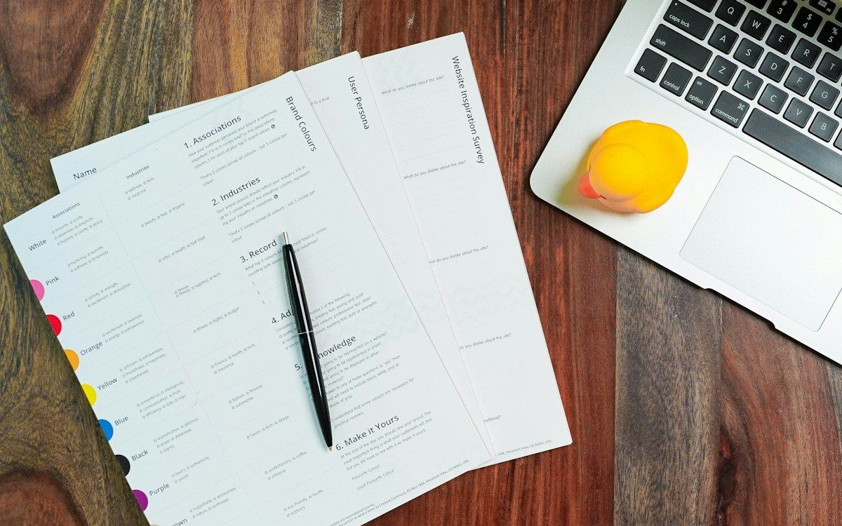 Website planning sheets laid out on a desk
