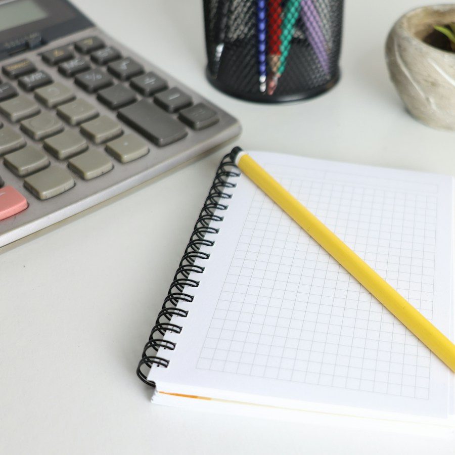 Calculator and notebook for quotes and invoices